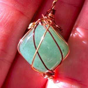 Aventurine wrapped in three tone copper wire on leather necklace.